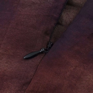 Detail view of the high-quality invisible zipper on a vintage tie-dye gradient skirt