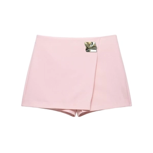 Fashionable light pink skort with asymmetrical wrap design and silver metal buckle detail