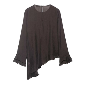 Detail of asymmetric layered hem and double ruffle flared cuffs on charcoal brown blouse