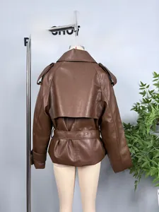 Back view of brown faux leather trench jacket showing belted waist and loose fit cut