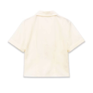 Short sleeve cream rivet detail shirt for women shown from a minimalist back view