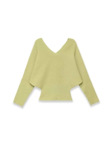 Detailed view of light green knit top with double V-neck and batwing sleeve design