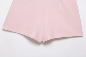 Close-up of pink skort details showing neat stitching and smooth cotton fabric texture
