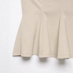 Chic beige ruffle hem camisole top featuring tiered flounce details for summer fashion
