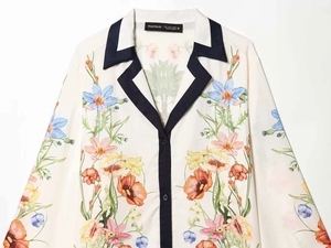 Detail of floral print long-sleeve shirt with V-neck collar and button-down design