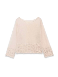 Detail view of apricot knit sweater featuring pleated hem and off-shoulder neckline design