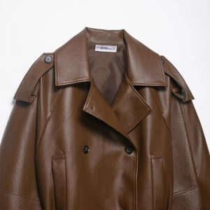 Vintage dark brown faux leather trench coat with double-breasted design and large lapels