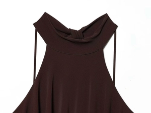 Detail of dark brown halter neckline with knot design and premium knitted texture