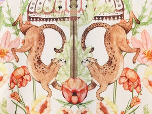 Macro detail of the high-quality silk fabric featuring classical floral and leopard prints