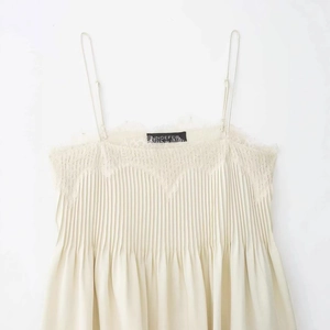 Elegant cream lace trim camisole with plissé pleated texture and adjustable thin straps