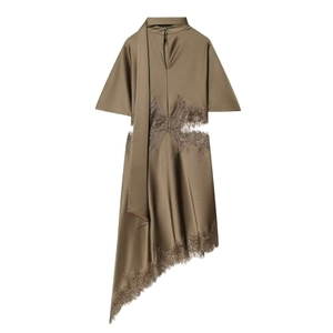 Detail of bronze satin dress featuring intricate eyelash lace trim and side cutouts