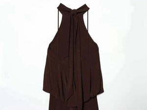 Detail of elegant chocolate brown halter maxi dress with back tie and satin fabric texture