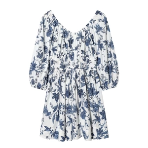 Robe vintage française à manches bouffantes et imprimé floral bleu sur fond blanc
