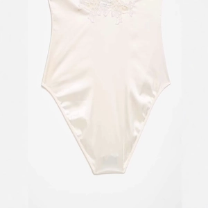 Elegant pearl white satin bodysuit for women with delicate floral lace embroidery