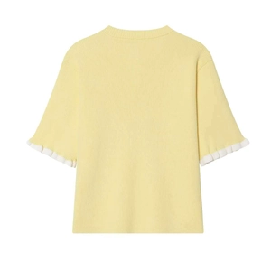 Back view of light yellow ribbed knit top with white ruffled sleeves and minimalist style