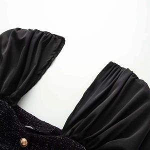 Chic black tweed top with puff sleeves and gold relief button detail on square neck