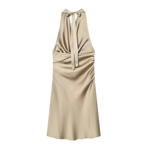 Detail of ruched champagne satin dress with elegant halter neck and bow tie closure