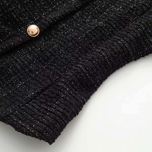 Sleeveless black tweed tank top with metallic thread and a rose gold button detail