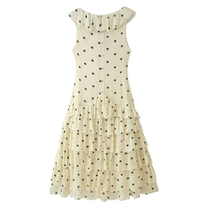 Robe sans manches à pois jaune pâle avec col à volants et jupe à plusieurs niveaux