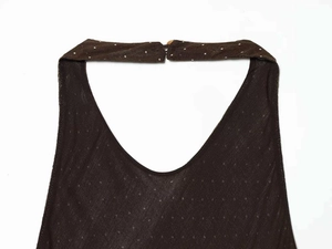 Macro shot of dark brown halter neck collar with buckle and polka dot mesh texture