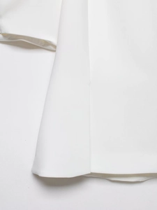 Close-up of white high-density twill fabric showing detailed stitching and premium texture