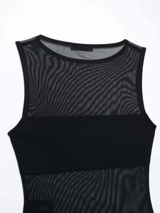 Close-up of the mesh patchwork detail and sheer fabric on this black sleeveless bodysuit