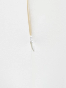 Macro shot of white invisible zipper closure and woven fabric texture on the top
