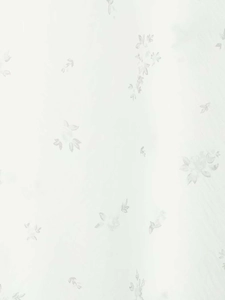 Detailed macro view of white floral embroidery on translucent nylon fabric for skirts