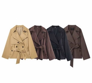 Flat lay of double-breasted trench coats in khaki, brown, black, and taupe with belts