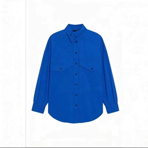 Minimalist bright blue long sleeve shirt with asymmetric collar and double pockets