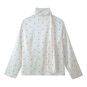 Elegant white polka dot long sleeve blouse featuring a stylish tie-neck ribbon detail