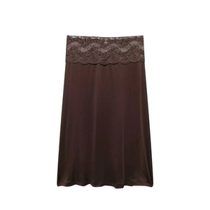 Detail of coffee brown satin skirt featuring an elegant wide lace waistband trim