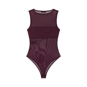 Detail showing the sheer mesh texture and opaque chest panels of the purple bodysuit