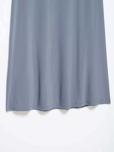 Detailed macro view of the double-stitched hem on this elegant misty blue lace skirt