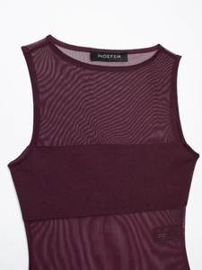 Detail view of burgundy sleeveless bodysuit with mesh paneling and round neckline