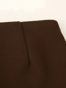 Close-up of premium dark brown felt fabric texture and professional stitching detail