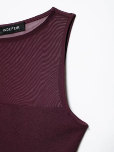 Detail of burgundy bodysuit featuring sheer mesh splicing and INDEFEIR brand label