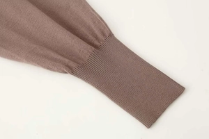 Detail of ribbed knit cuff on a summer cardigan showing high-quality fabric texture