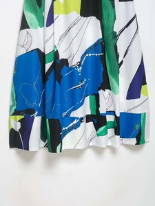 Close-up of artistic abstract floral print midi skirt with delicate ruffled hem details