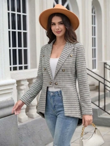 Detail of classic houndstooth blazer featuring double-breasted buttons and asymmetric hemline