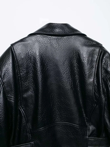 Detailed close-up of premium black lychee texture leather jacket collar and back seams