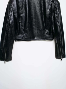 Detailed back view of black lychee grain leather jacket with silver cuff zippers