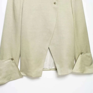 Light khaki stand collar shirt with asymmetric hem and vintage metal button details