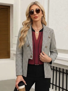 Detail of classic houndstooth blazer with notched lapel and double-breasted buttons