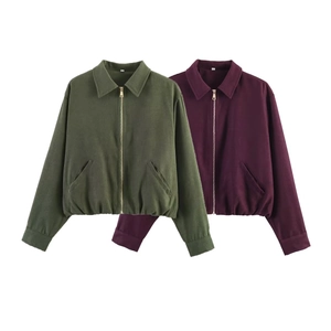 Detail of army green and wine red zip-up pilot jackets with lapel collars and elastic hems