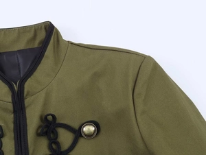Detail of olive green jacket featuring shoulder pads and vintage metal frog closure