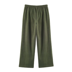 Detailed view of elastic waistband and olive green wide-leg trousers in smooth matte fabric