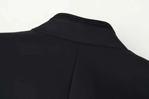 Detailed close-up of the black blazer back neckline with shoulder padding and stitching