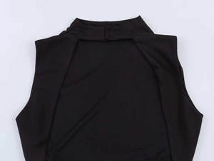 Close-up of black sleeveless dress featuring a high neckline and unique shoulder cutouts