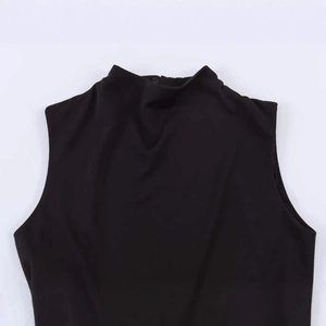 Minimalist black mock neck sleeveless dress with elegant back button closure